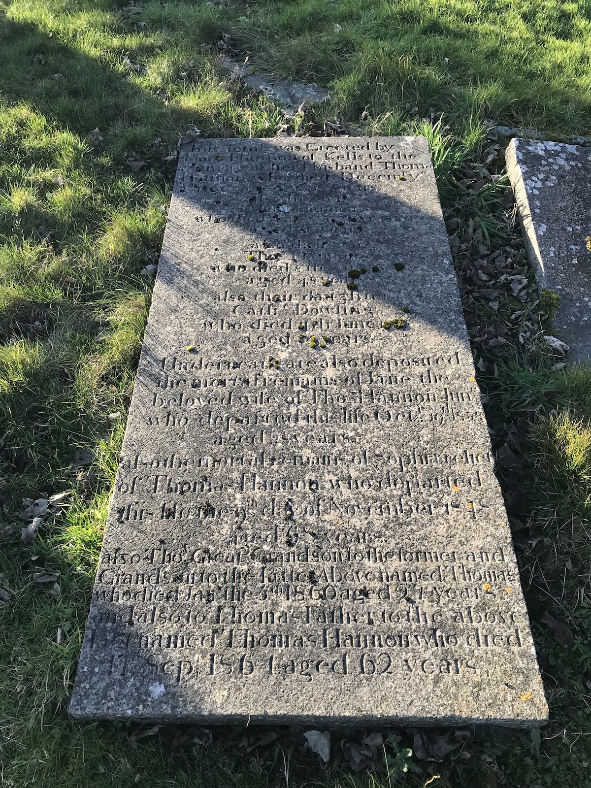 Recumbent grave slab in raking sunlight